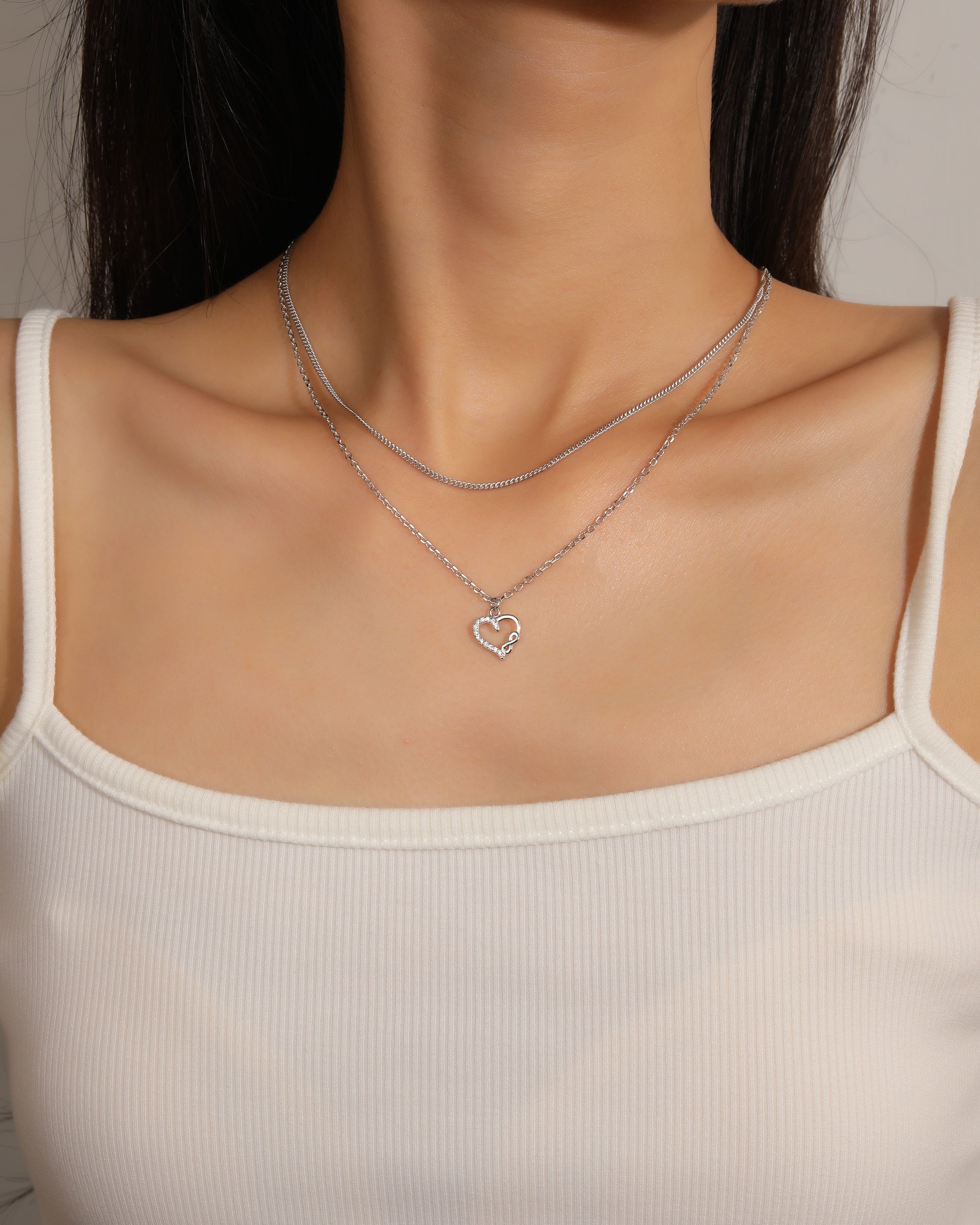 Collar doble de corazon e infinito con circonia blanca 45+5cm en rodizado