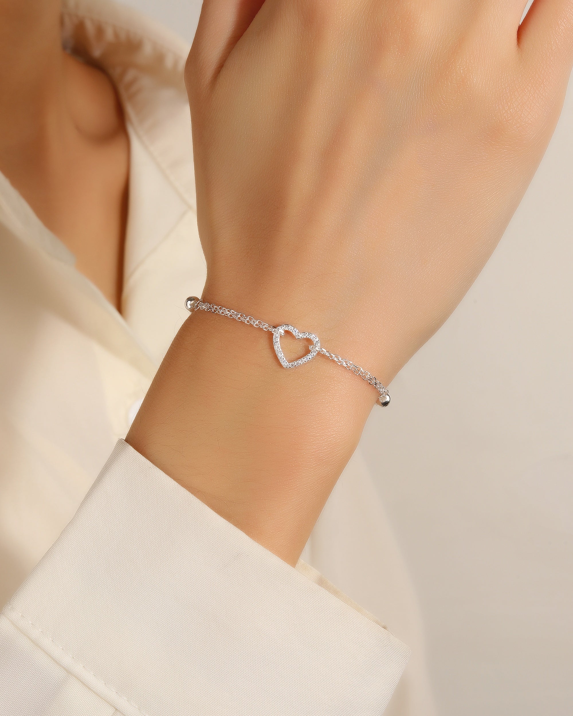 Pulsera doble de corazon con circonia blanca 17+3cm en plateado