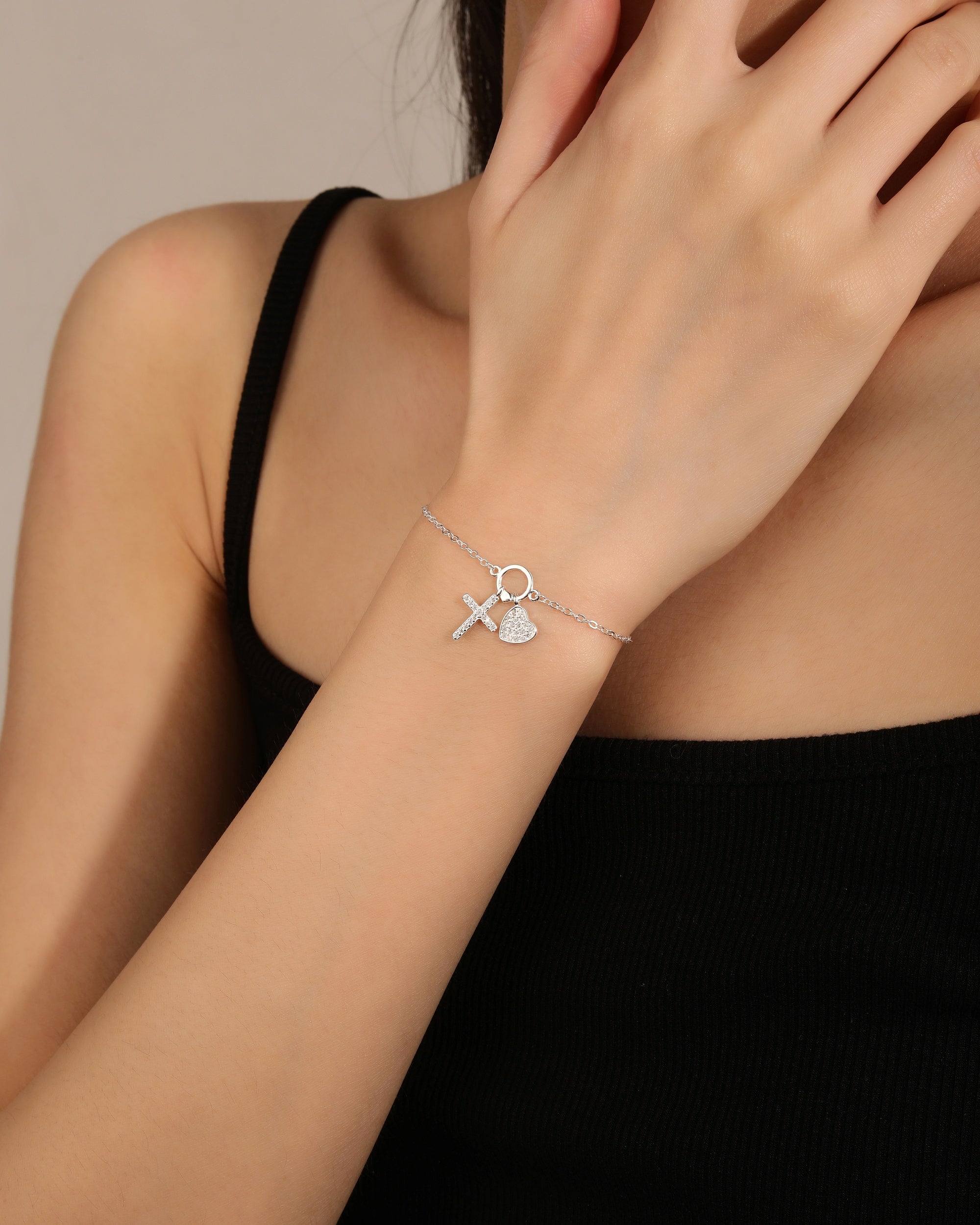 Pulsera de cruz/corazon con circonia blanca de 17+3cm en plateado
