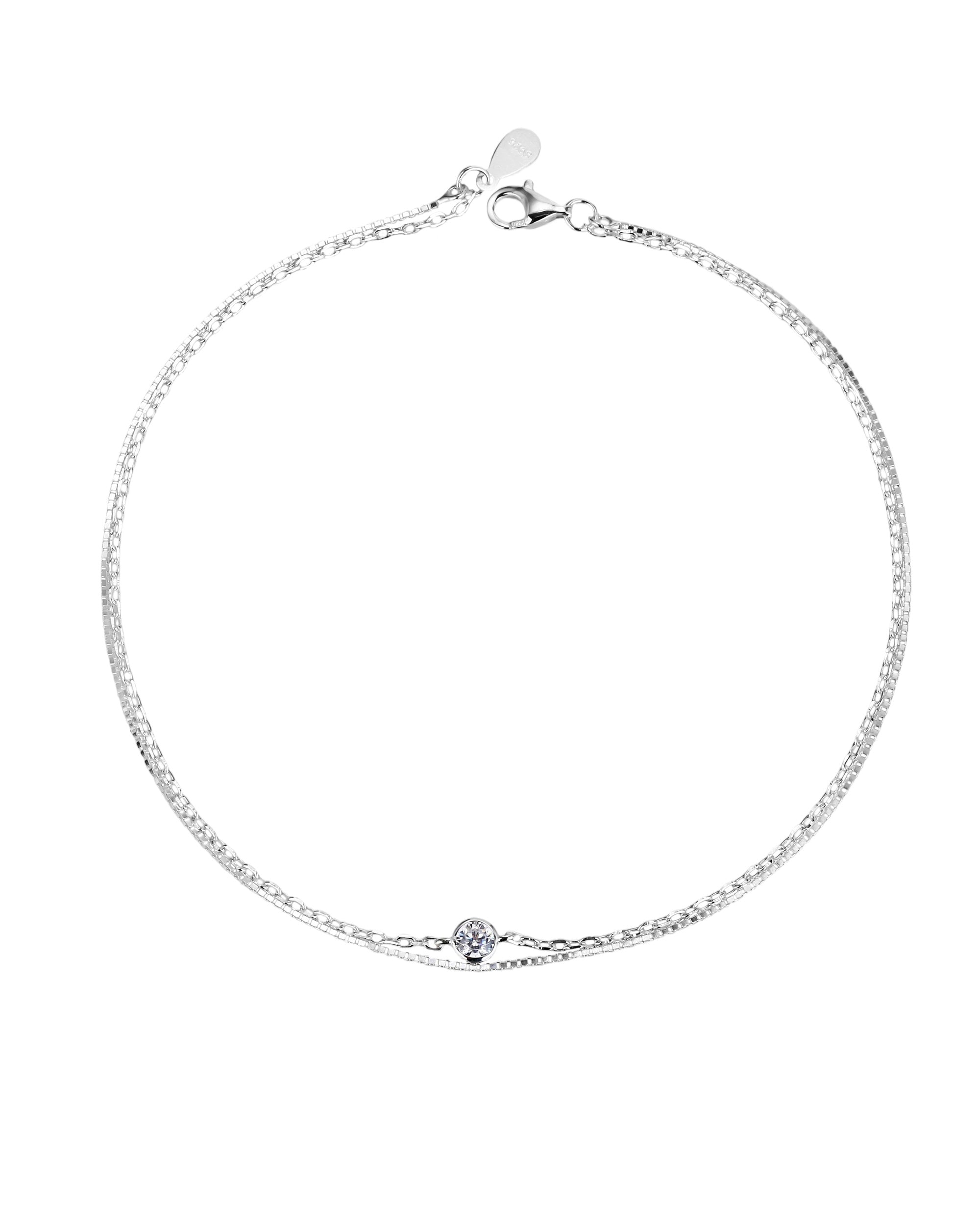 Tobillera doble cadena con circonia redonda blanca en plateado