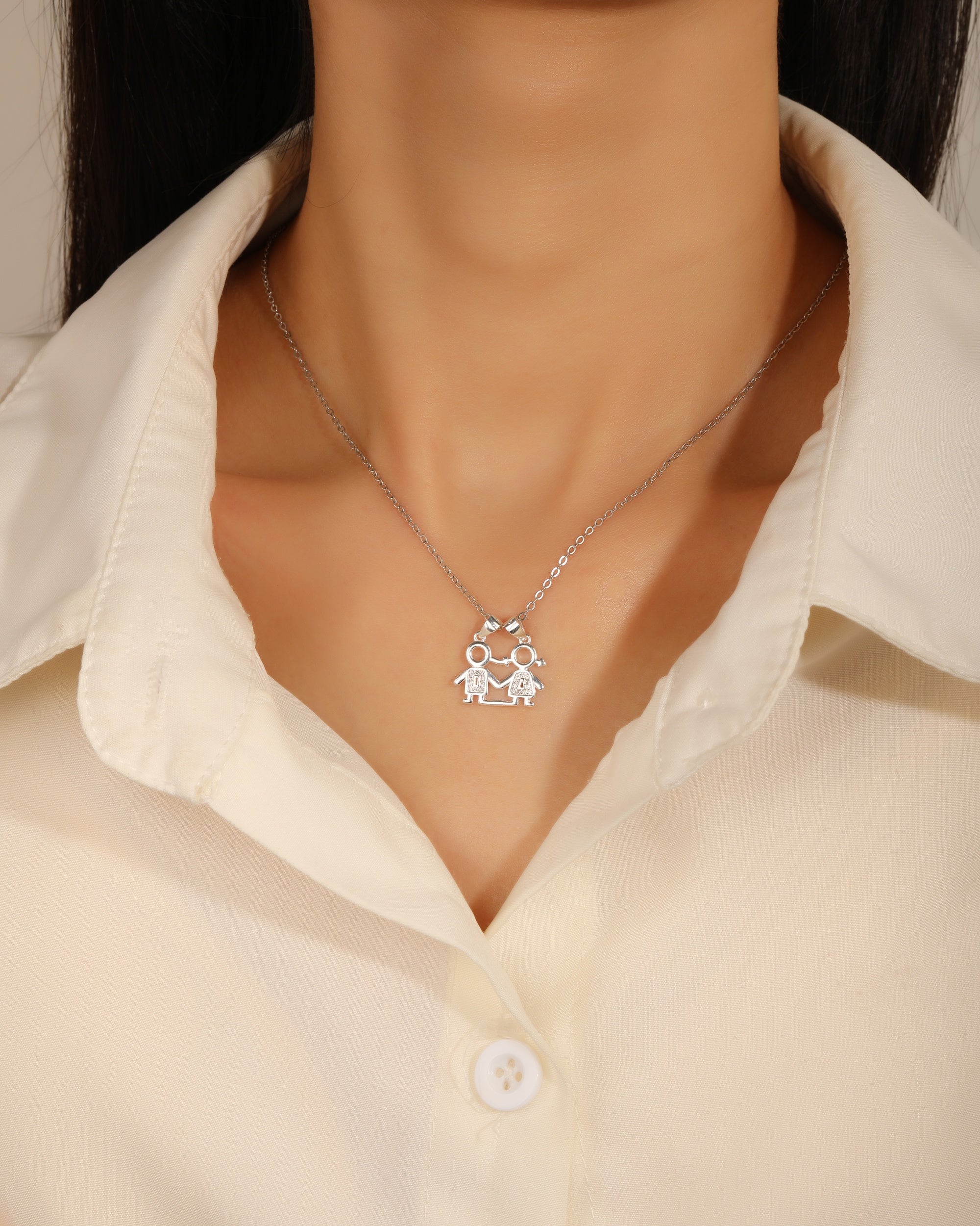 Dije de pareja con circonias blanca en plateado