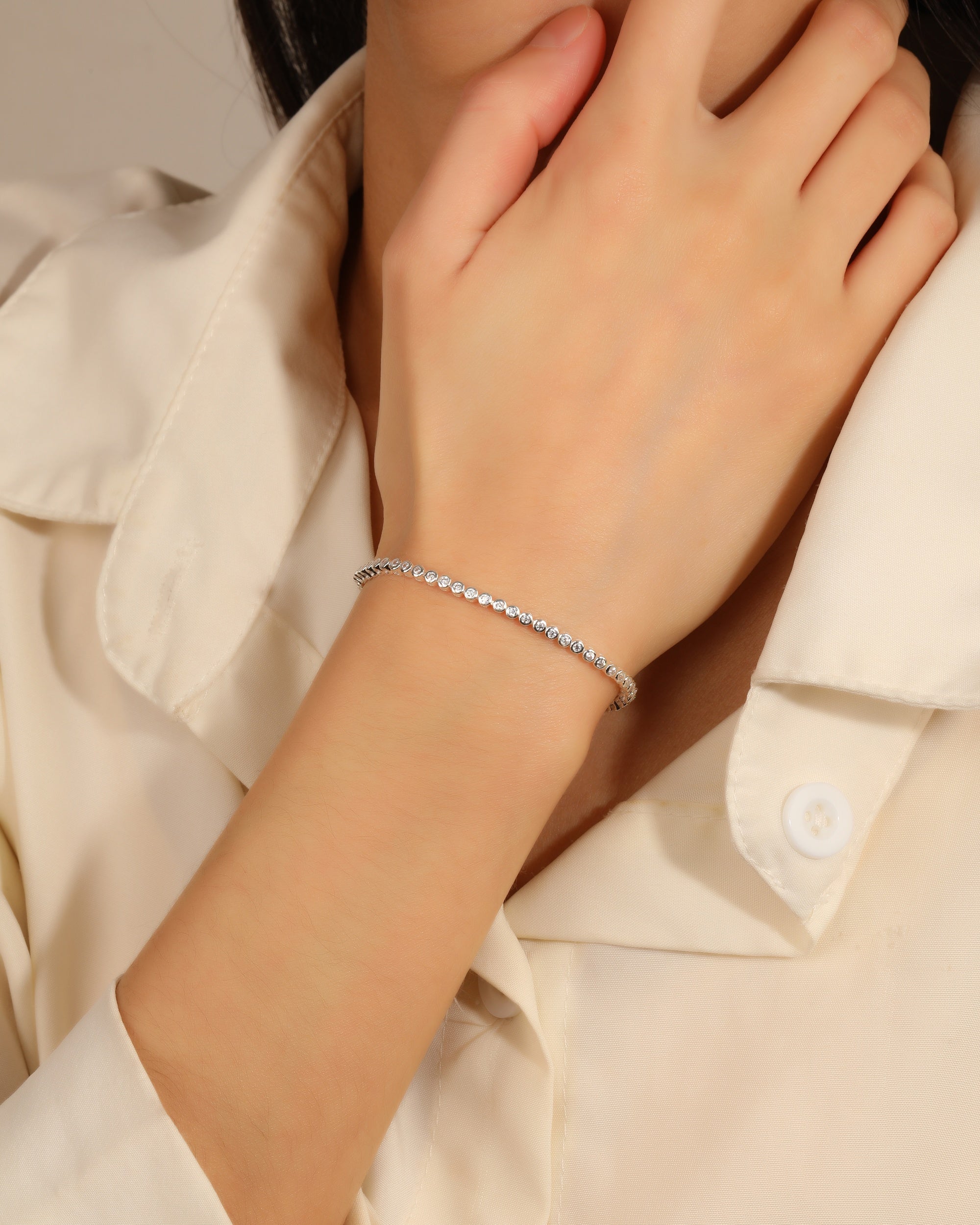 Pulsera tenis con circonia redonda blanca 18cm en plateado