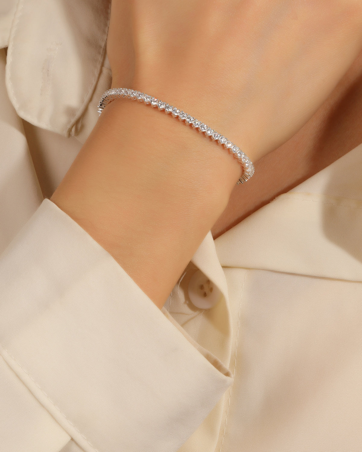 Pulsera tenis ajustable 2mm con circonia triángulo 18cm en plateado