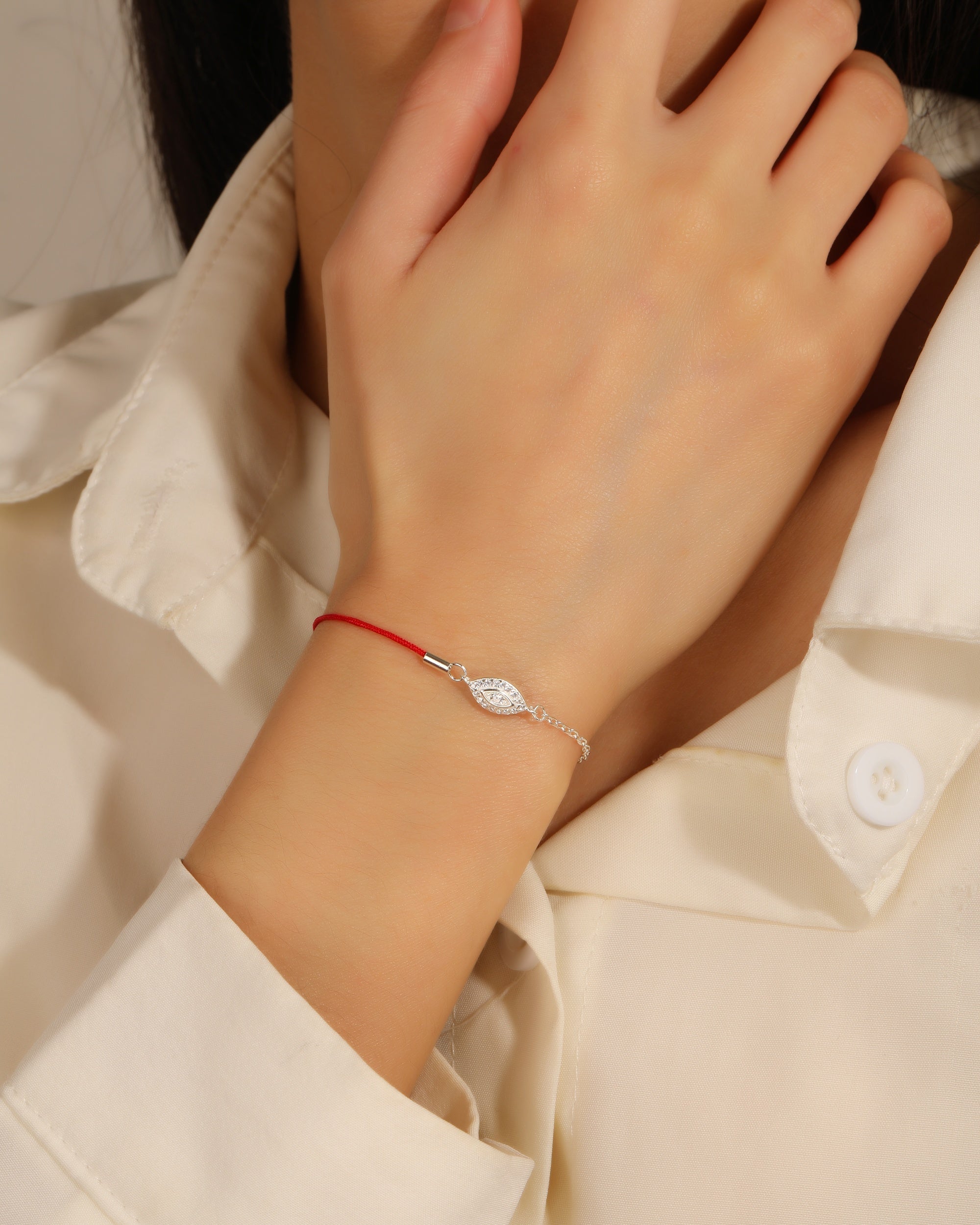 Pulsera sencilla de ojo de dios con hilo 17+3cm en plateado