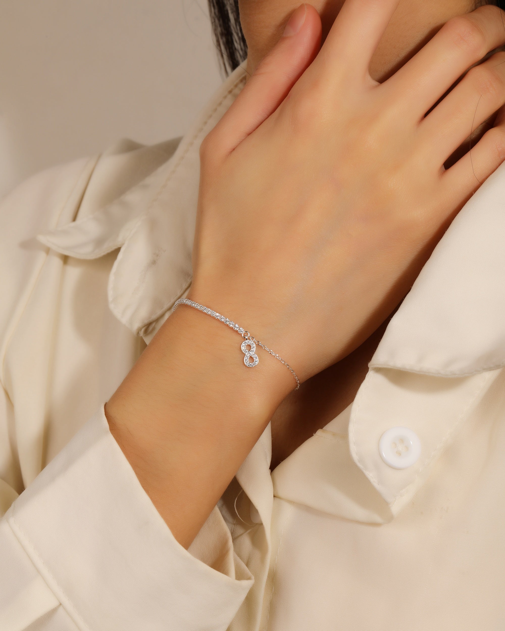 Pulsera tenis de 1.5mm con infinito y circonia blanca 17+3cm en plateado