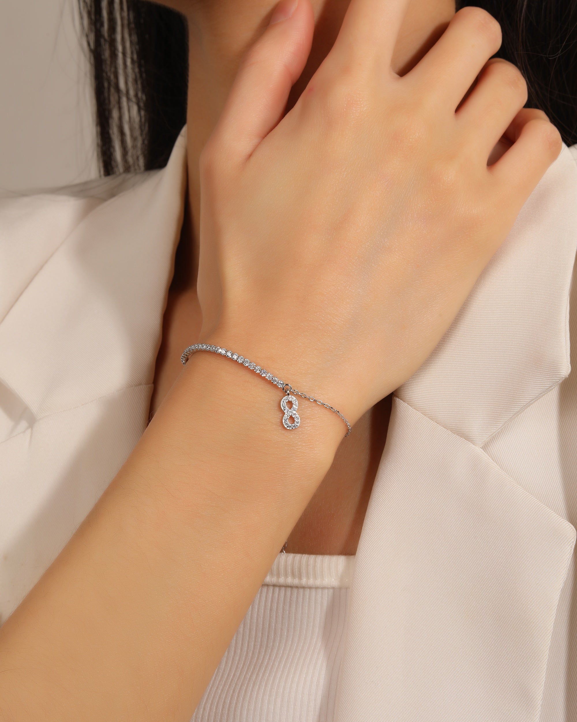 Pulsera tenis de 1.5mm con infinito y circonia blanca 17+3cm en rodizado