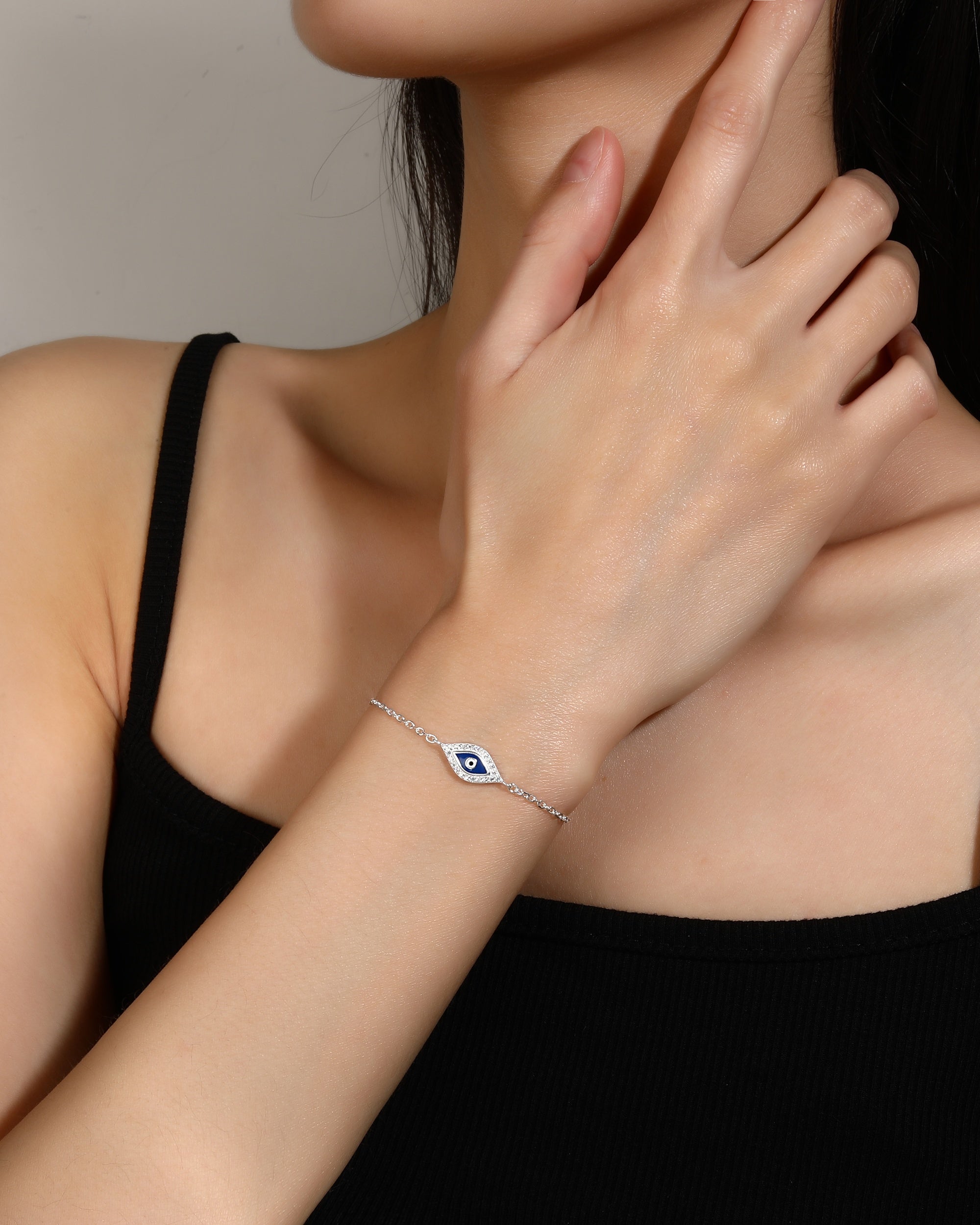 Pulsera ojitos con esmalte azul 17+3cm en plateado
