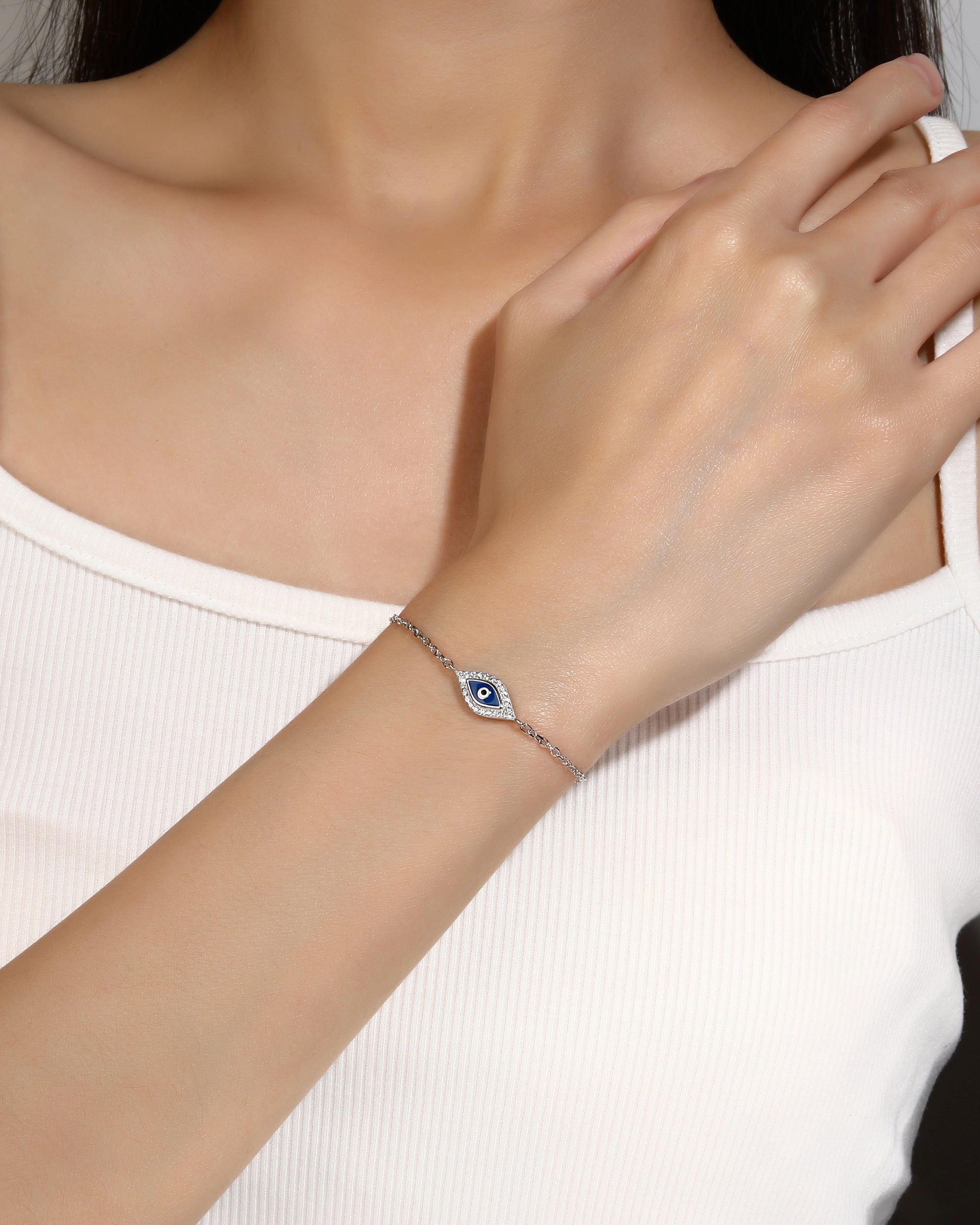 Pulsera ojitos con esmalte azul 17+3cm en rodizado