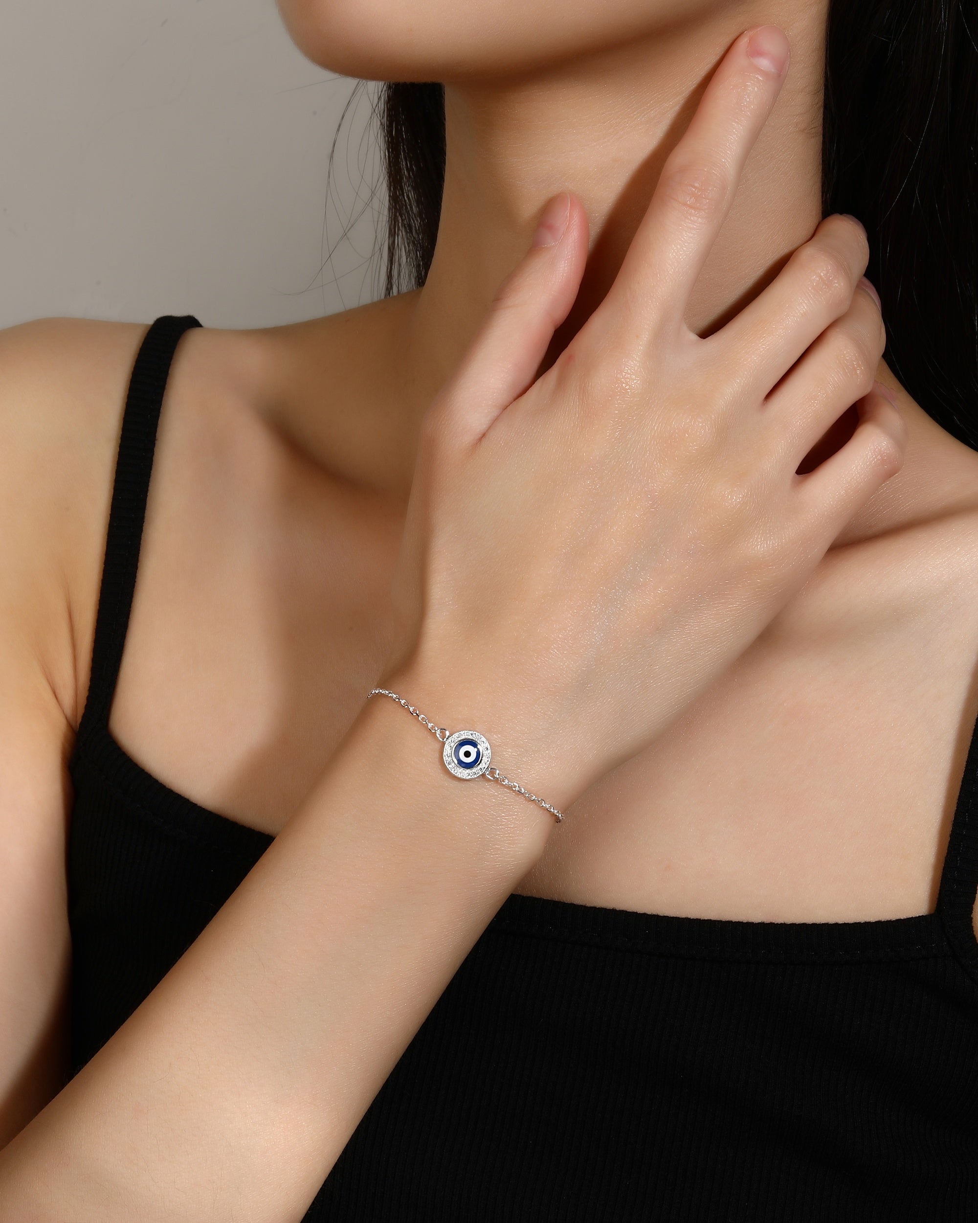 Pulsera ojitos redondos con esmalte azul 17+3cm en plateado