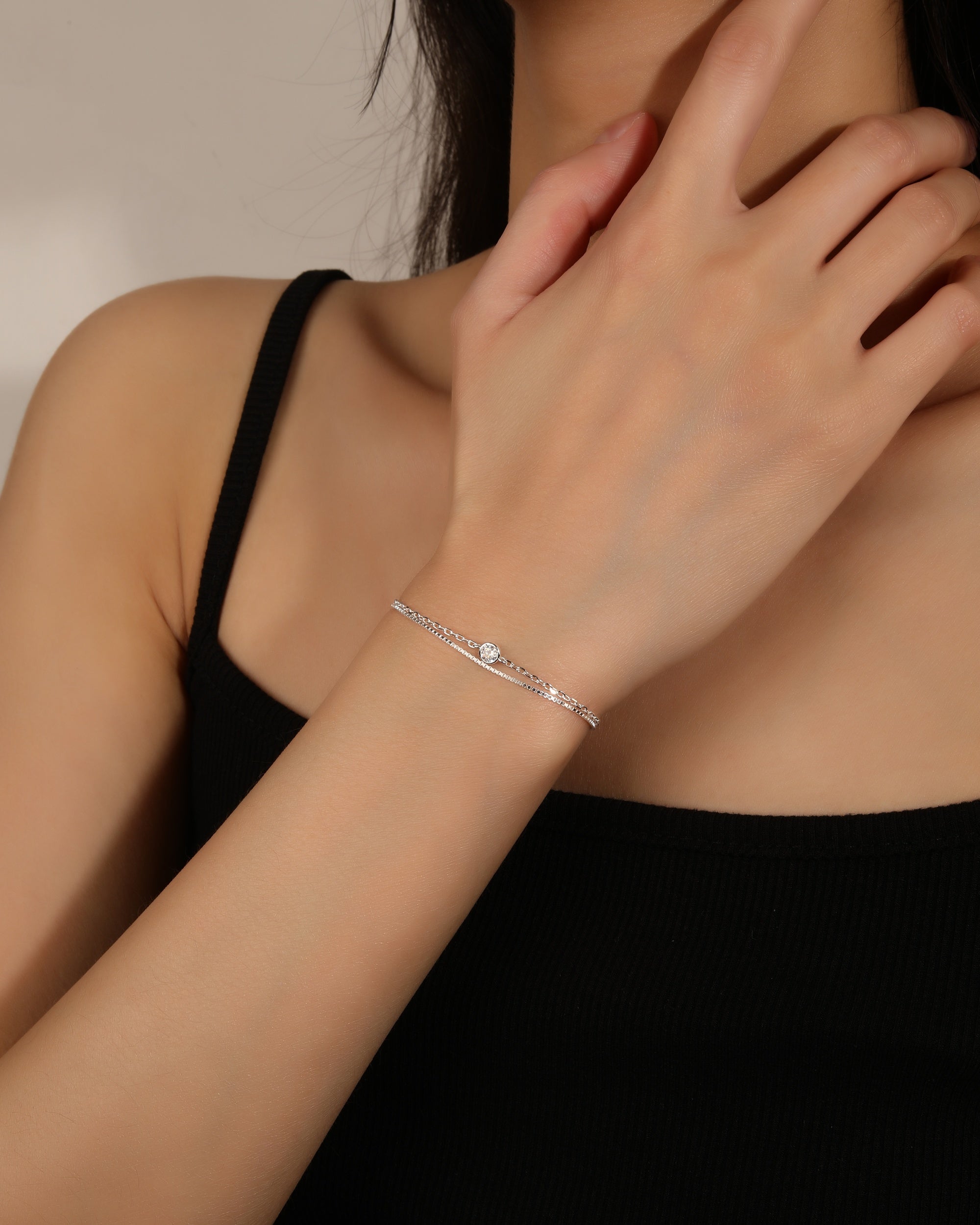 Pulsera doble con circonia bicelada en plateado