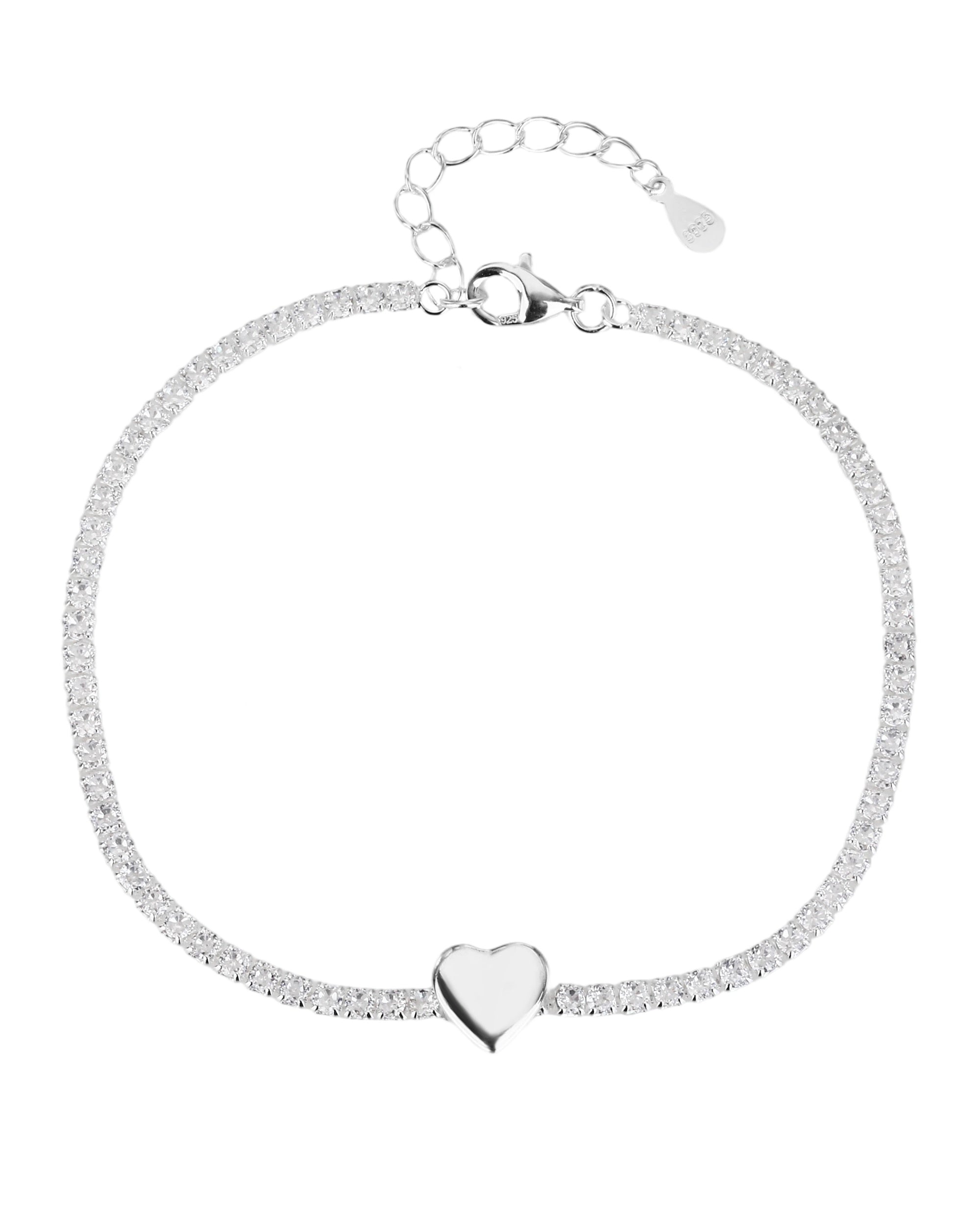 Pulsera de tenis con pasador de corazon liso y circonias blancas en plateado