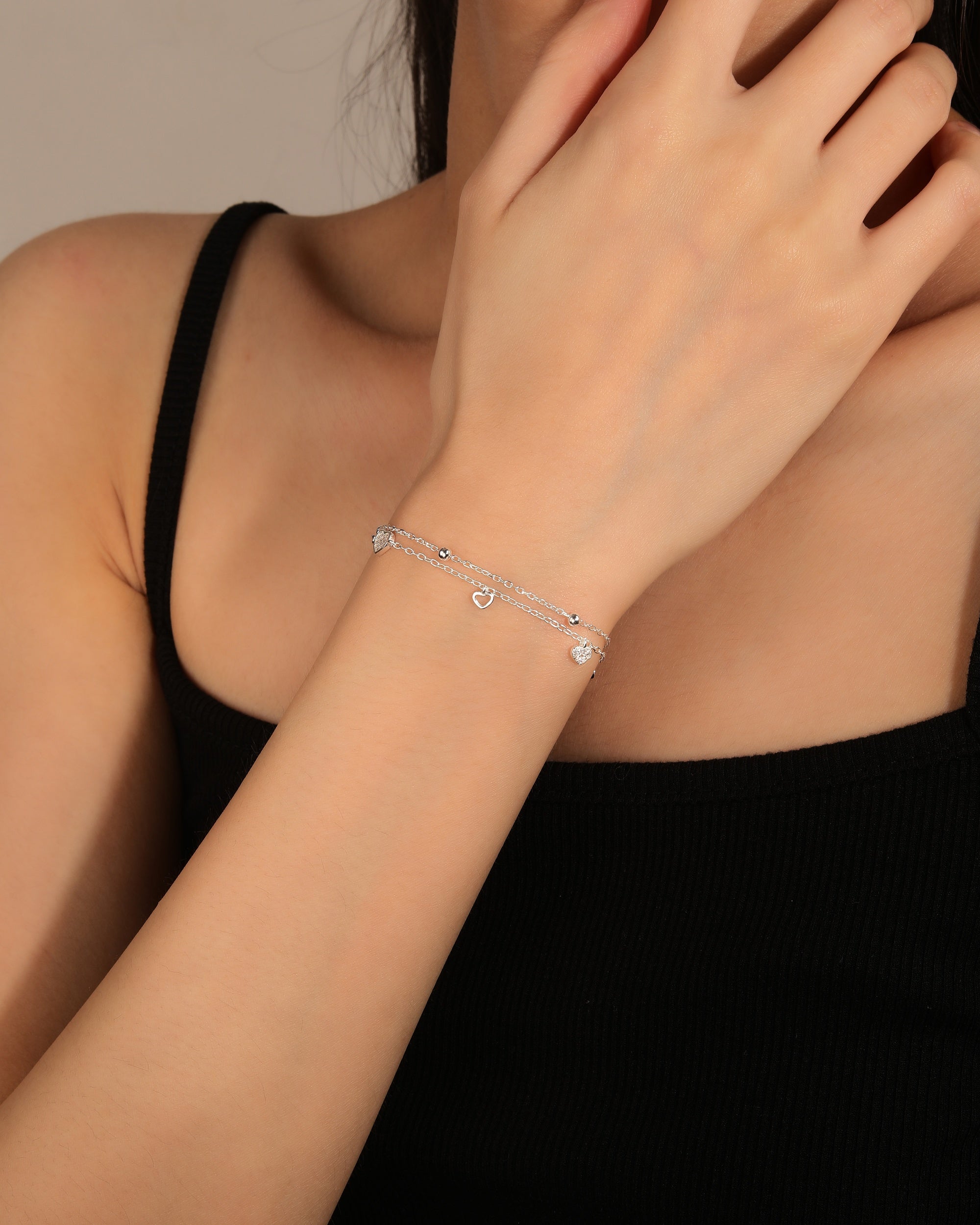 Pulsera doble de corazones con circonia blanca de 17+3cm en plateado