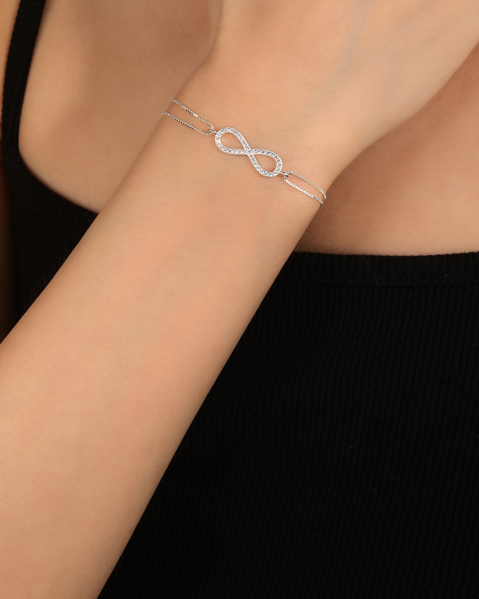 Pulsera doble con infinito y circonia blanca 17+3cm en plateado