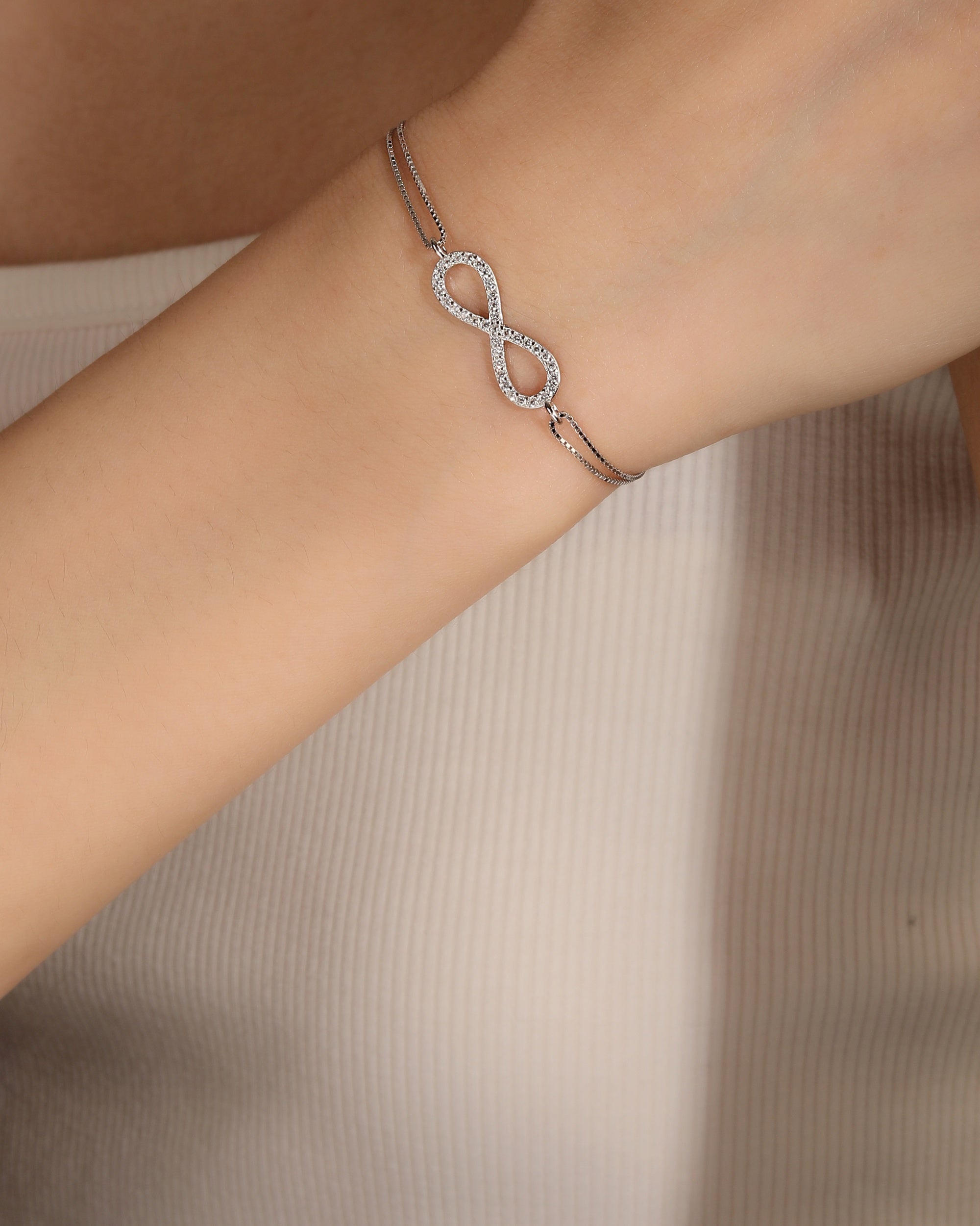 Pulsera doble con infinito y circonia blanca 17+3cm en rodizado