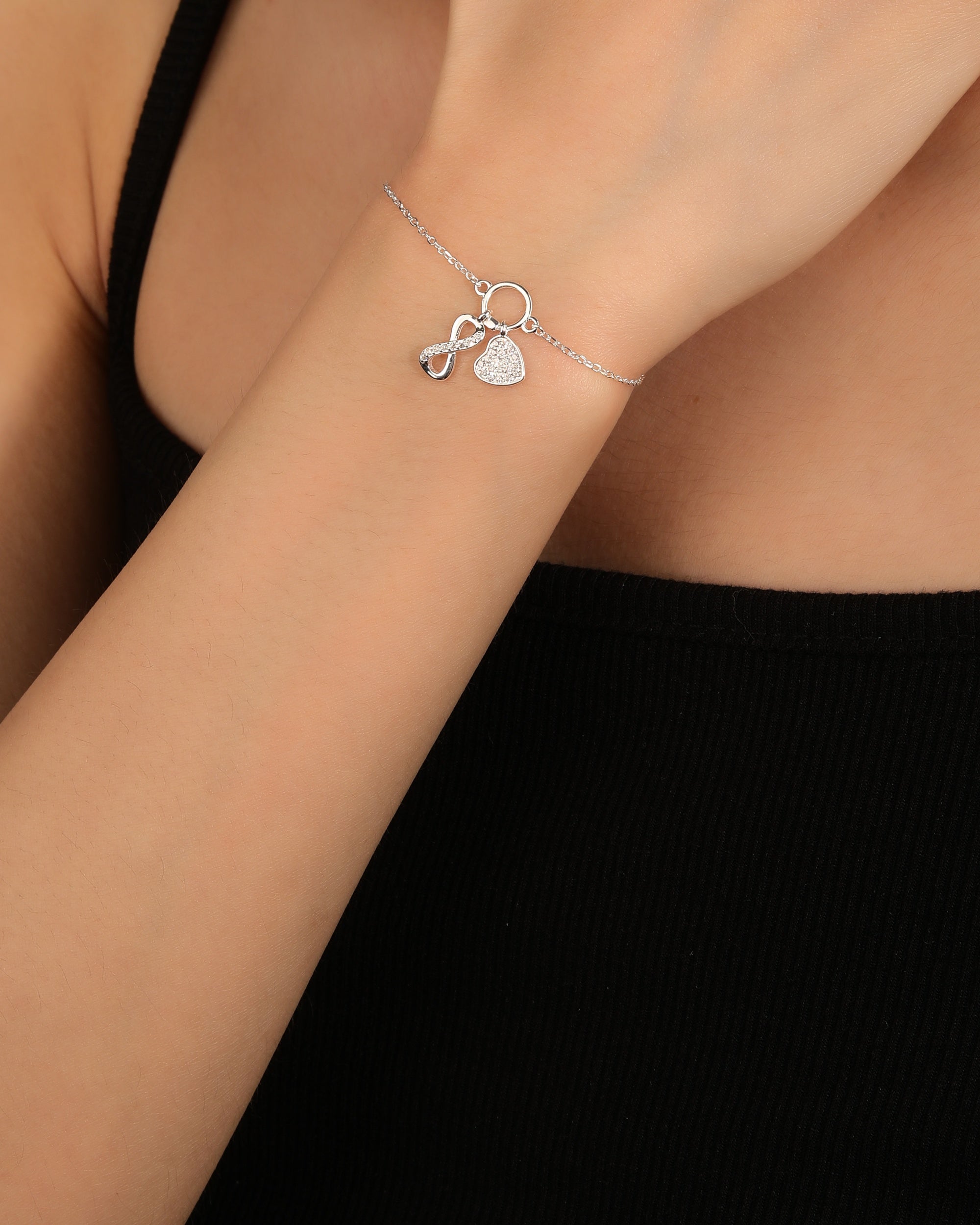 Pulsera sencilla de corazon e infinito con circonia blanca 17+3cm en plateado