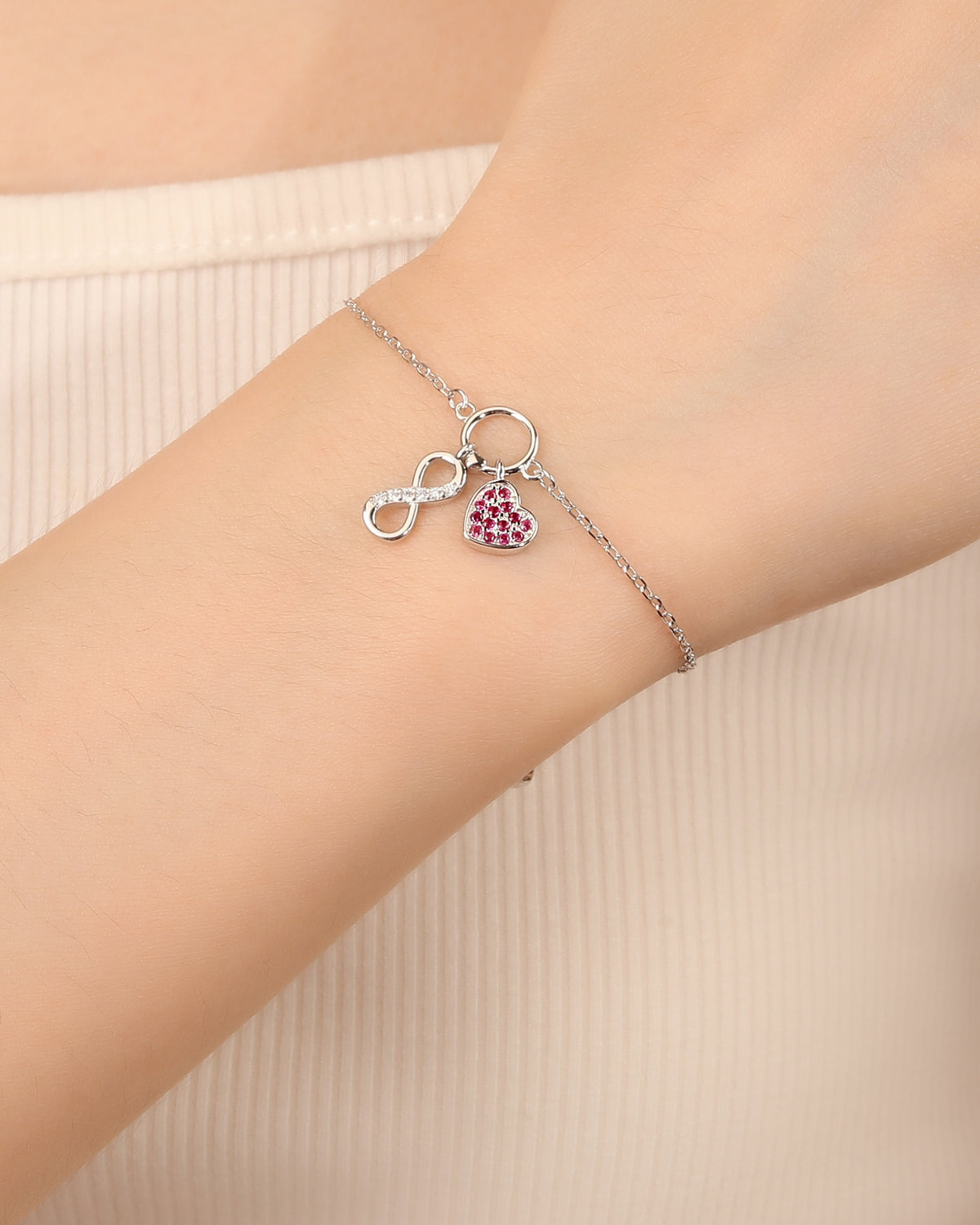 Pulsera sencilla de corazón e infinito con circonia 17+3cm en rodizado